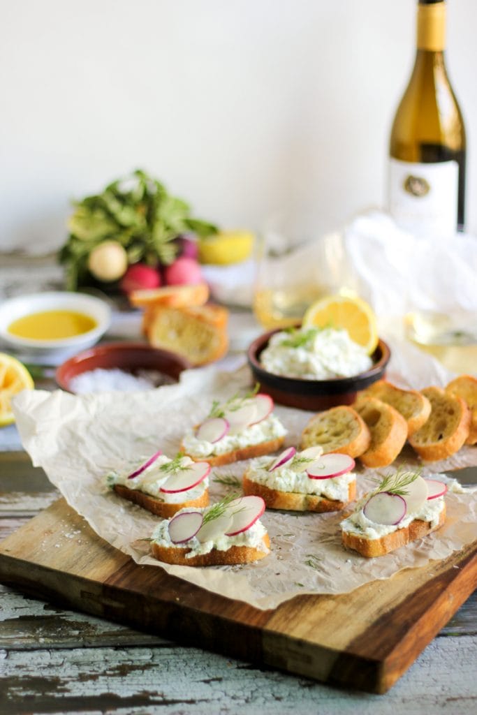 Radish and ricotta on a wooden tray.