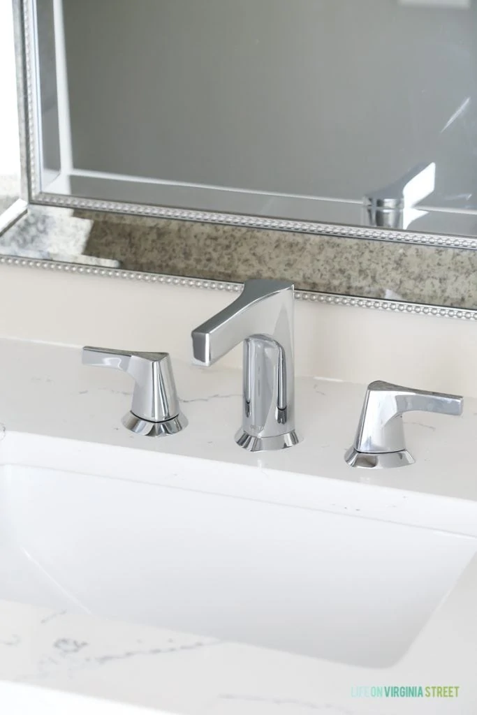 Countertops are Daltile One Quartz in the Luminesce color and Delta Faucet Zura faucet that we installed ourselves.