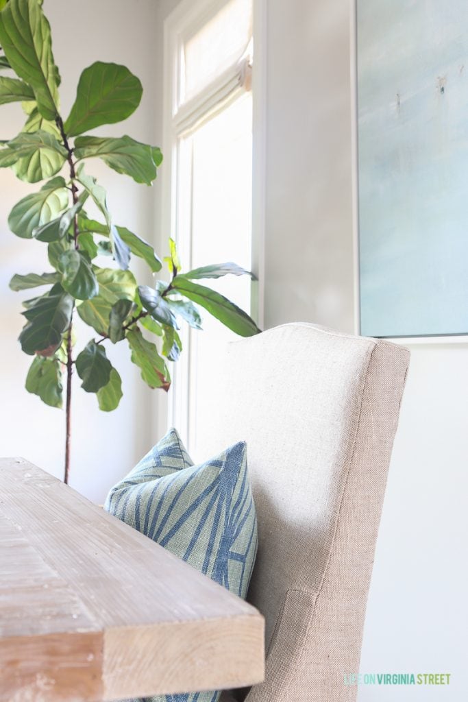 Kelly Wearstler Katana pillow in a coastal dining room.