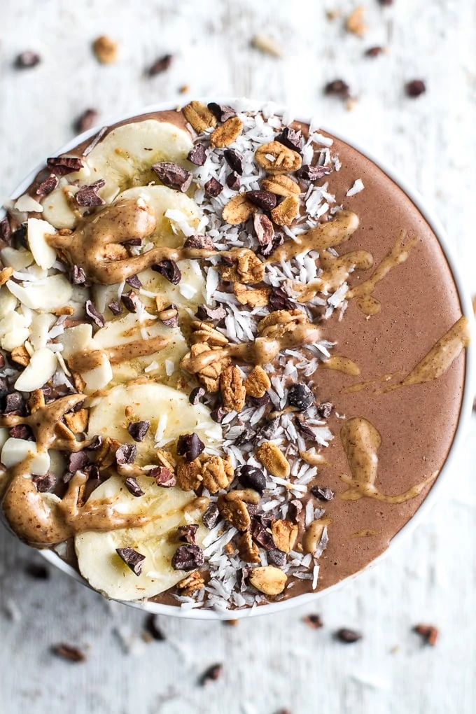 Hot chocolate smoothie bowl, with peanut butter drizzled on top.