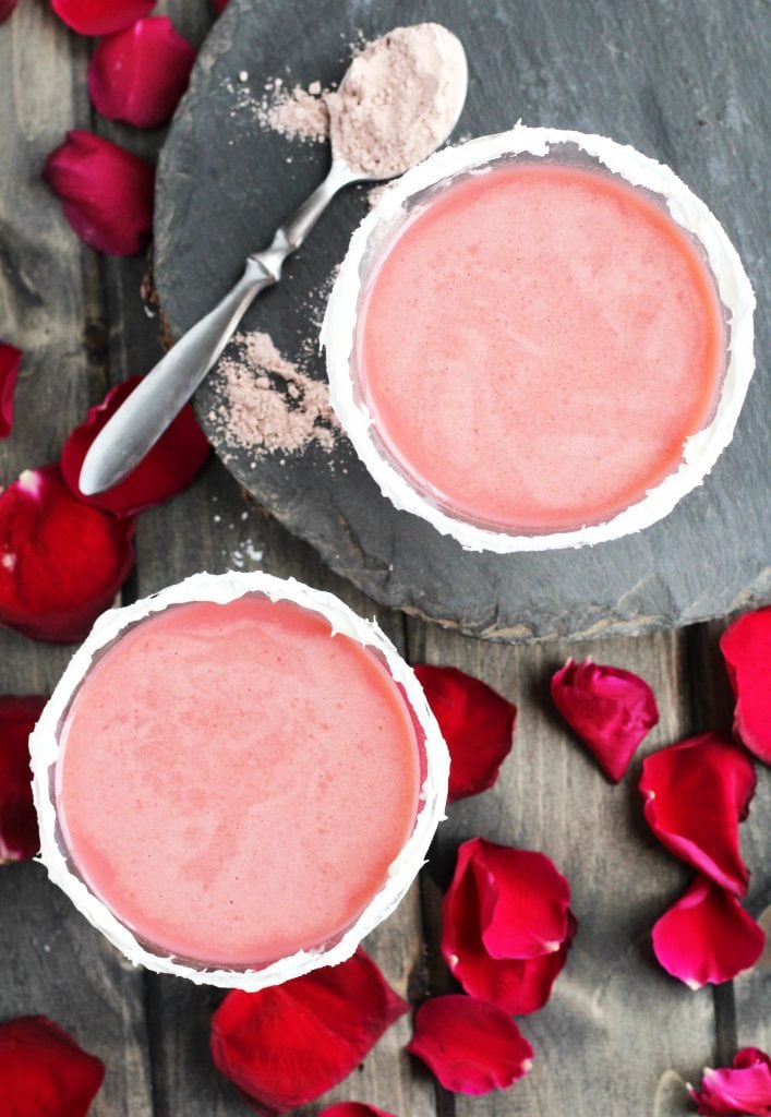 Velvet cake martini surrounded by rose petals.