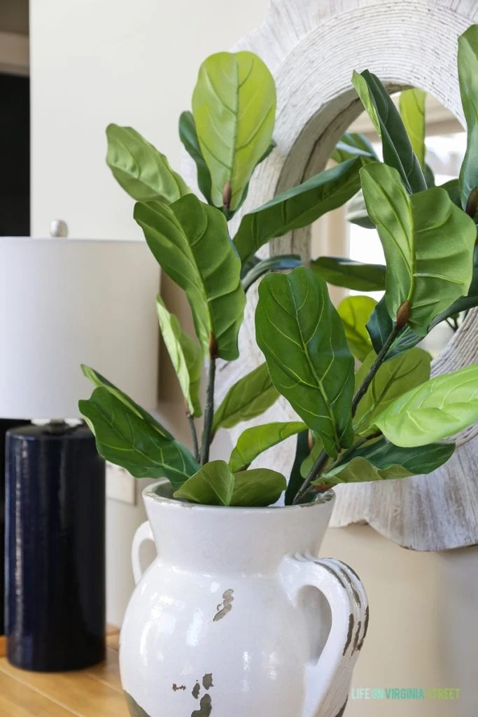 Faux fiddle leaf fig stems in a Pottery Barn urn vase.
