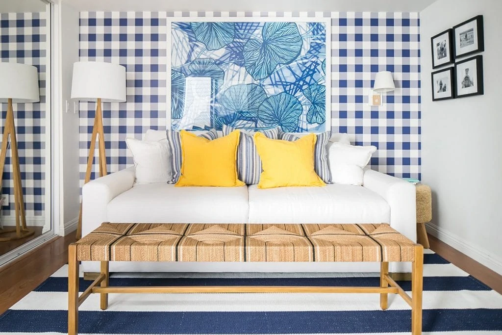 Buffalo check and bright yellow make this small room really pack a punch! It's got a great beach house look. 