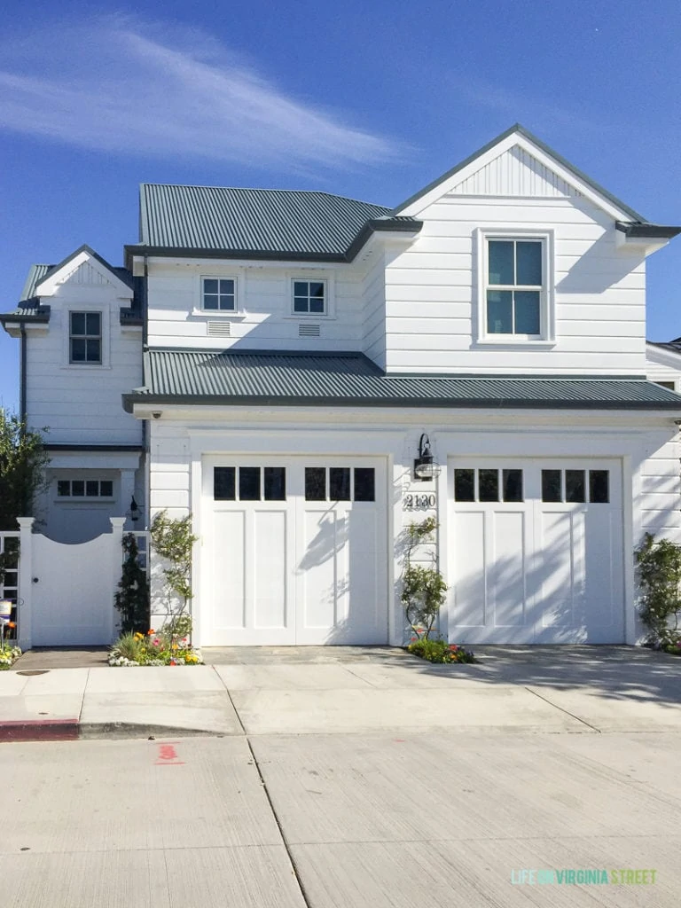 I love the look of this Southern California home, with the all white paint and trim and black roof!