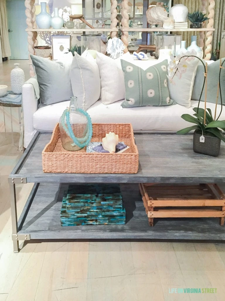 Gorgeous white couch, throw pillows and coffee table from Bliss Home Designs. 