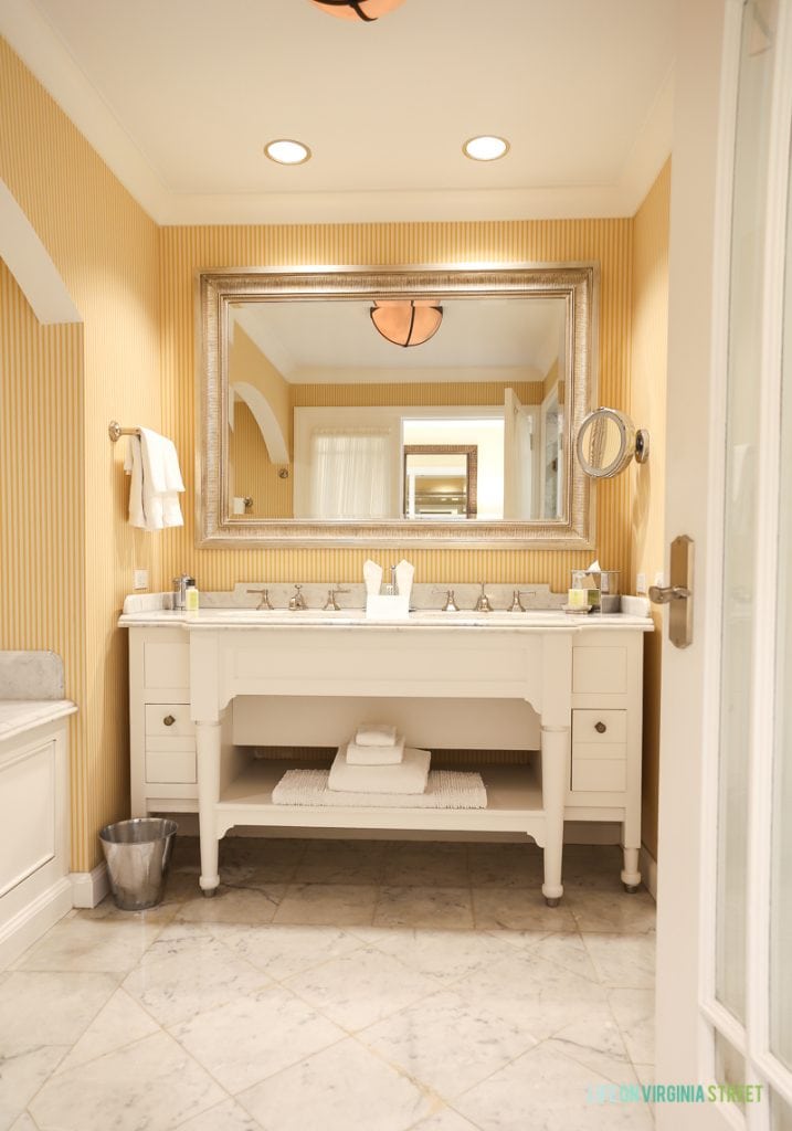 A white large sink and vanity in the hotel room.