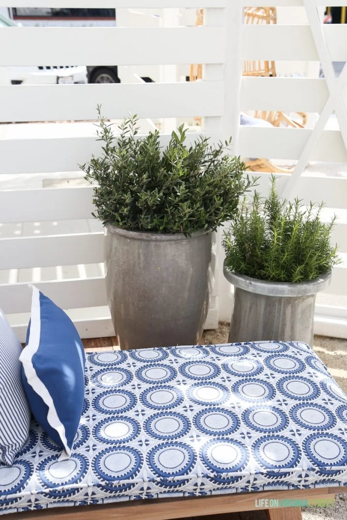 Beautiful silver planters and settee with gorgeous blue and white fabric from Serena & Lily.