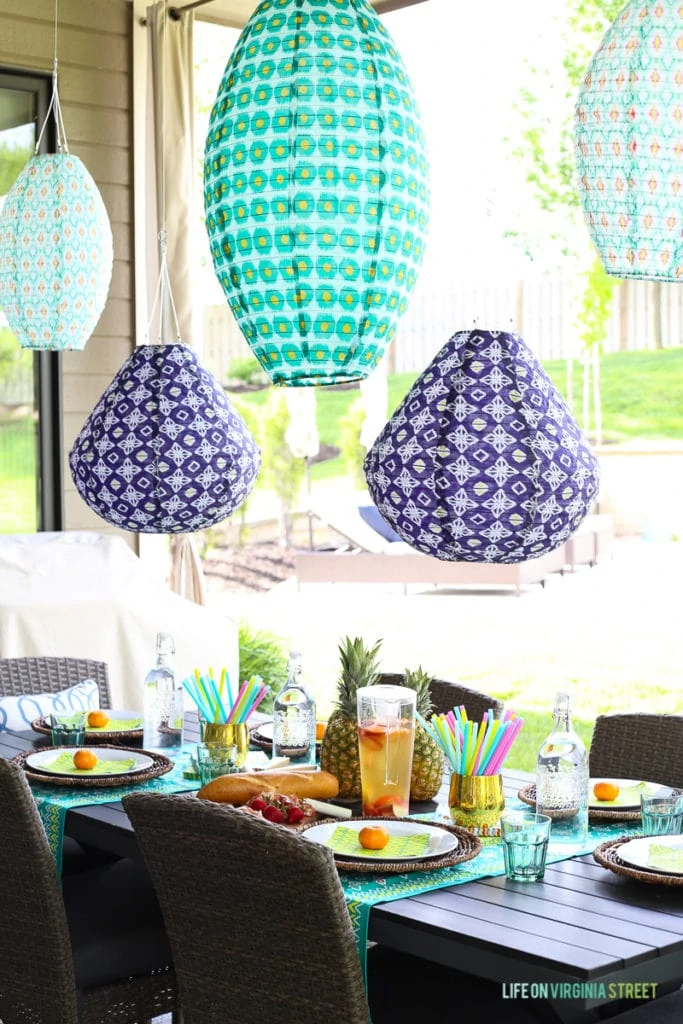  Love the colorful blue and aqua outdoor lanterns, pineapple centerpiece and turquoise table runners. 