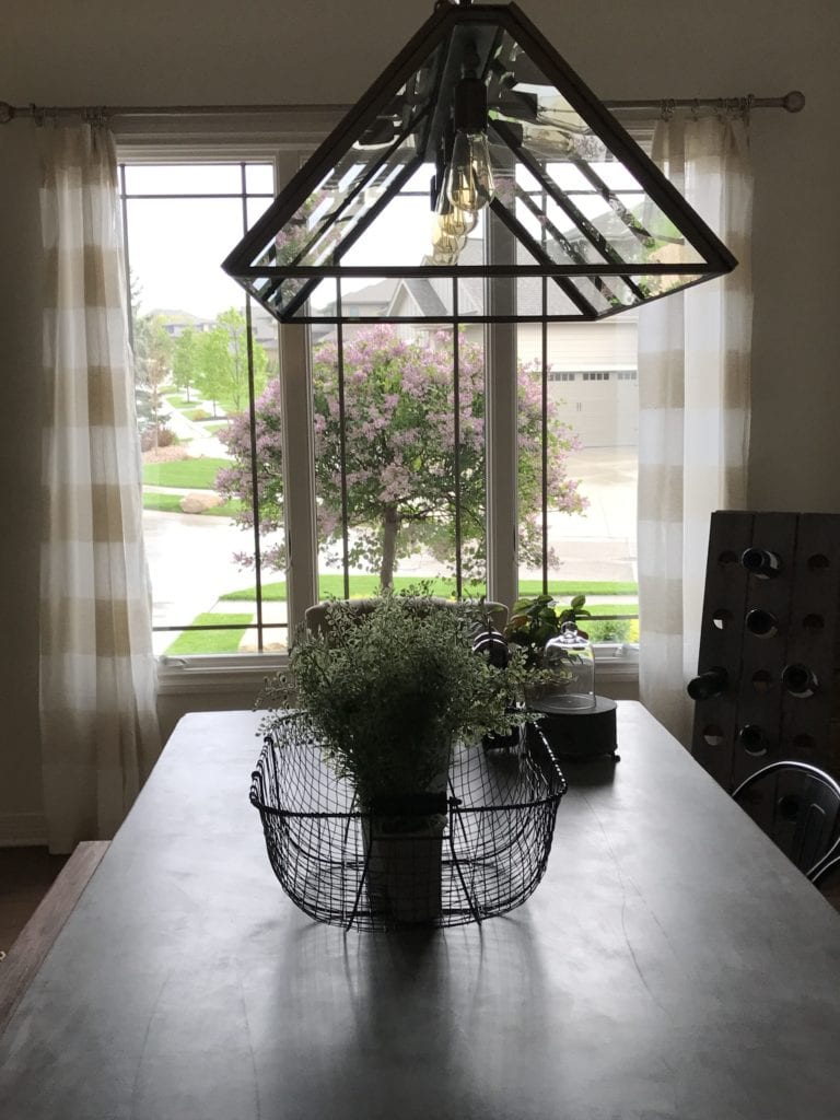 Pottery Barn Greenhouse Light Fixture in a Dining Room