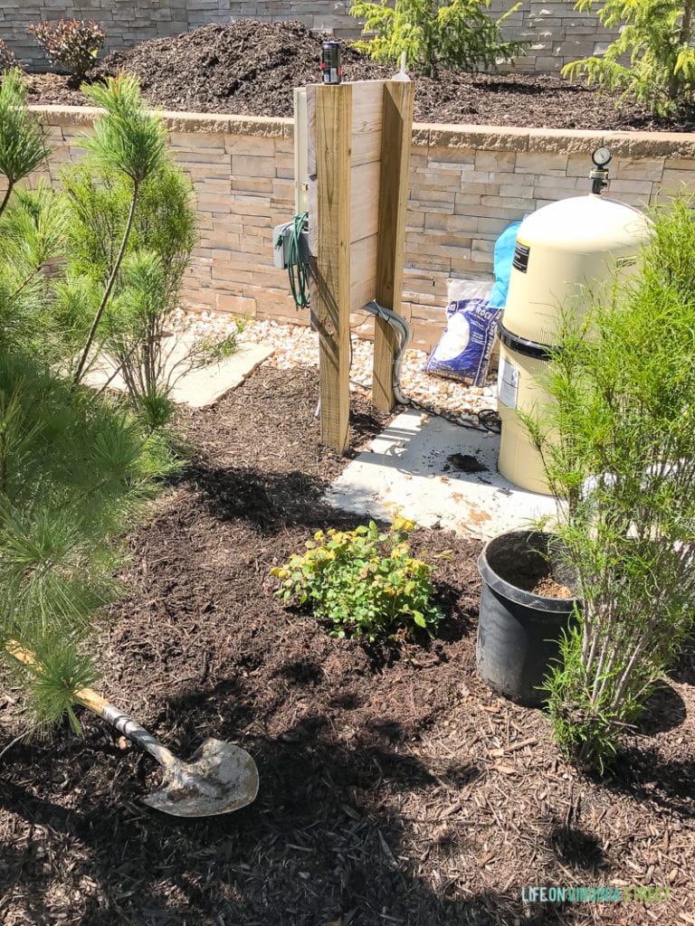 The pool equipment beside the garden.