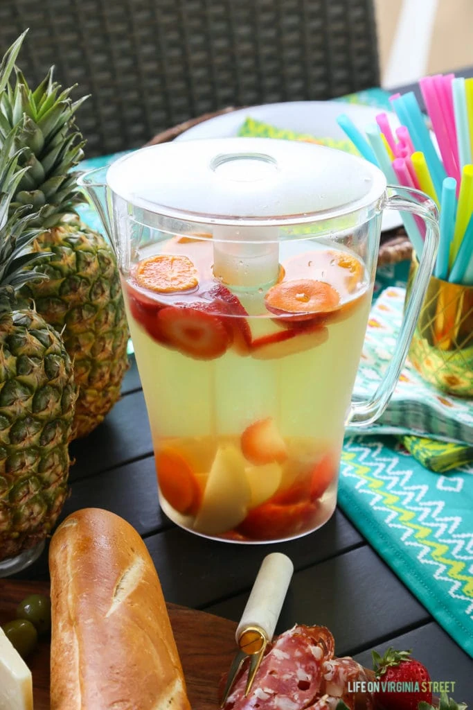 A drink pitcher with a frozen insert to keep the drink cool while being outside.