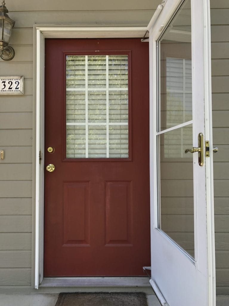 The dark red door of the house.