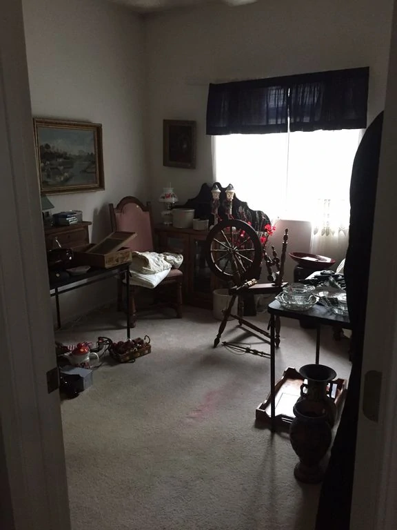 A spare room filled with junk items.