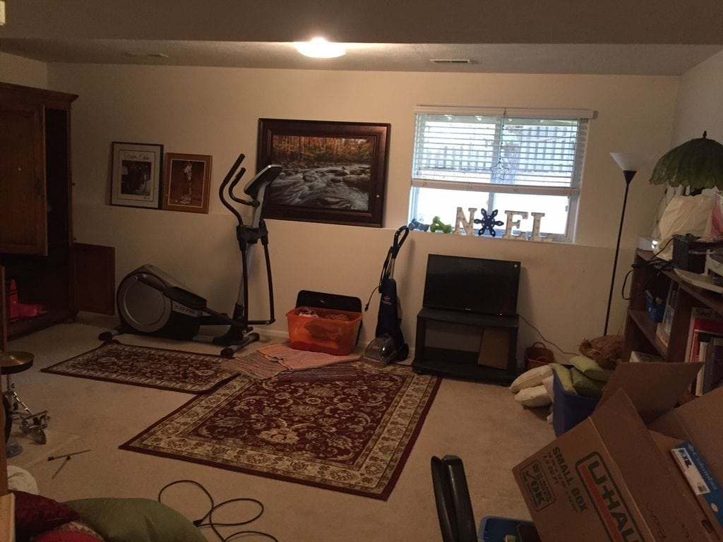 Pictures, and exercise bike, a vacuum, and a tv in the spare room.