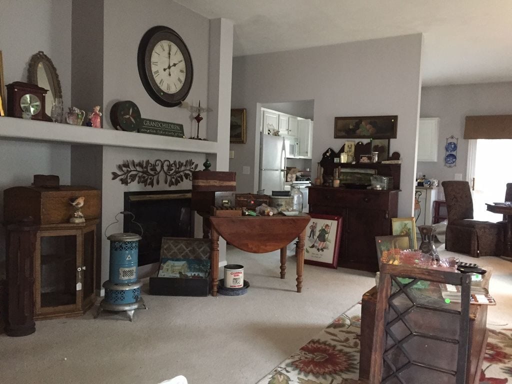 Furniture and items everywhere in a house before the renovation.