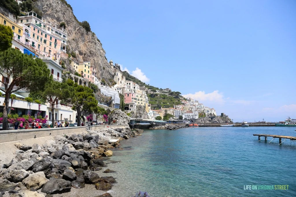 The buildings and restaurants by the ocean in Italy.