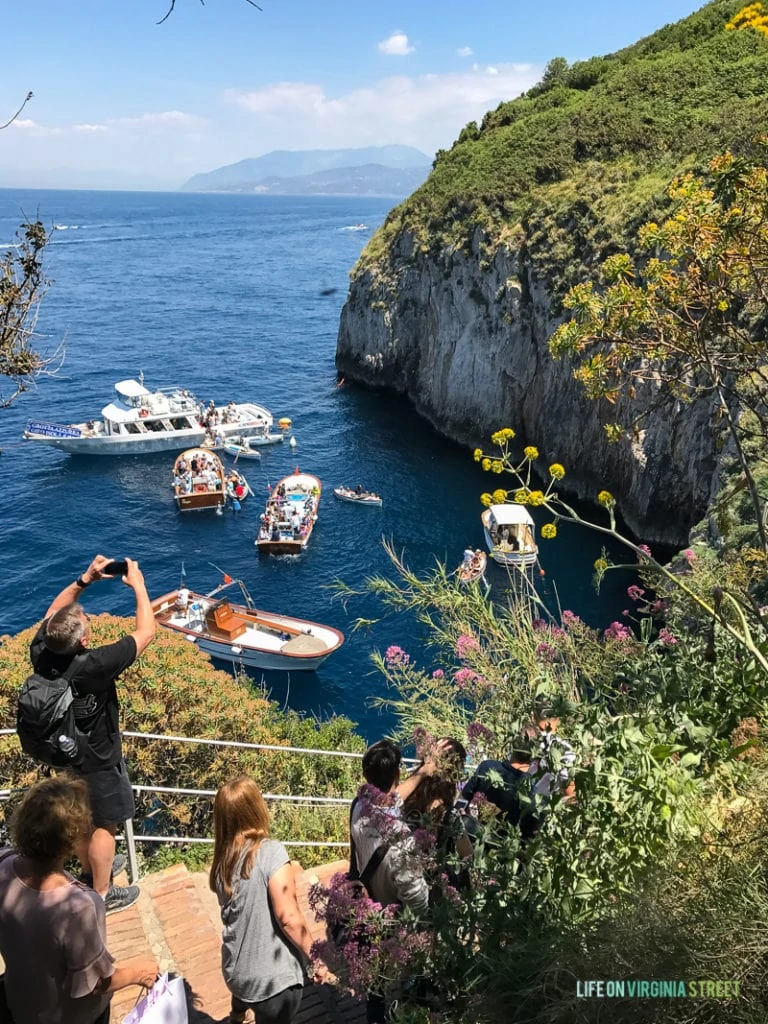 Tourists taking pictures from the pathway up the mountain.