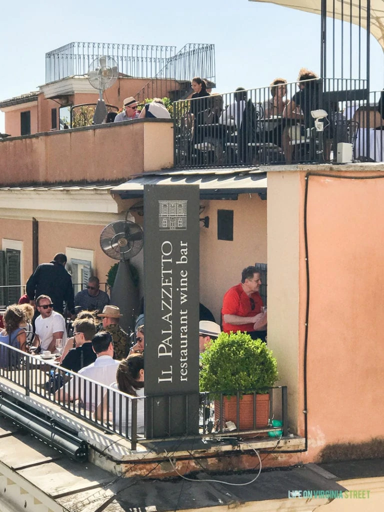 People sitting at a restaurant wine bar.