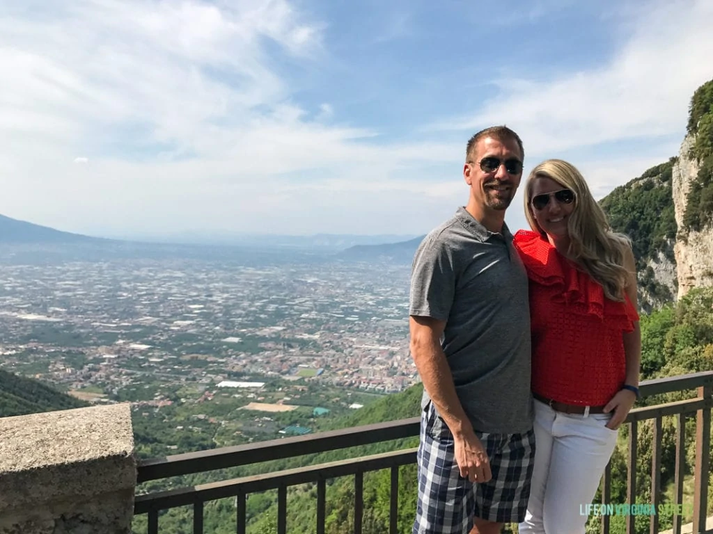 A picture of a couple on top of Mount Vesuvius.