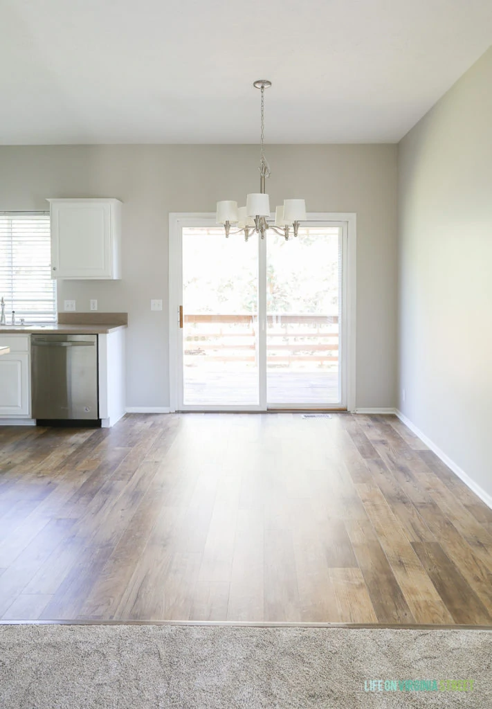 The sliding door off the dining area leading to the outside.