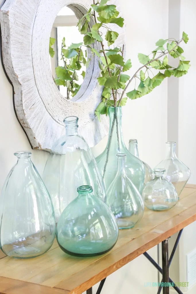 This collection of recycled glass vases is perfect for a coastal vibe. Love the ginkgo greenery as well!