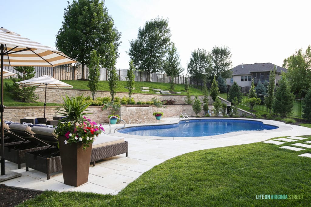 This is the view today, complete with our amazing pool, cement pavers and poolside chairs and umbrellas.