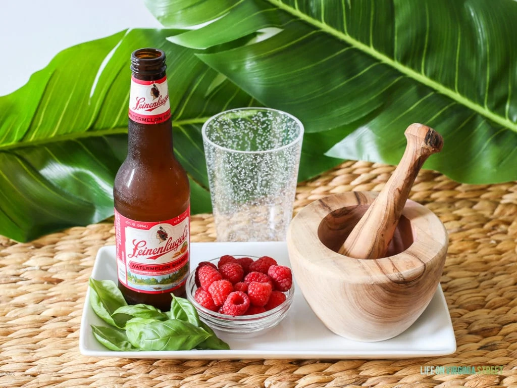 A delicious beer cocktail featuring Leinenkugel's Watermelon Shandy, Raspberries and Basil. The perfect poolside drink!