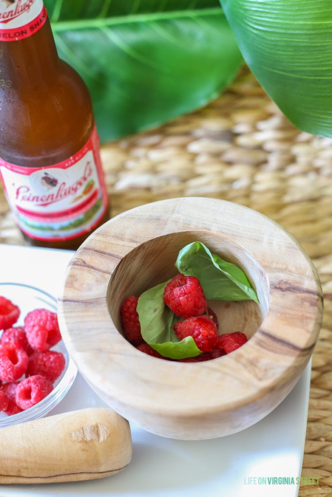 A delicious beer cocktail featuring Leinenkugel's Watermelon Shandy, Raspberries and Basil. The perfect poolside drink!