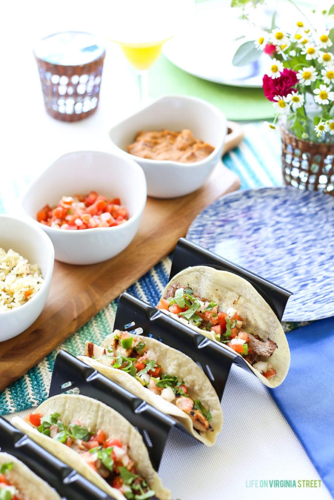 Grilled tacos in the shells on the table.