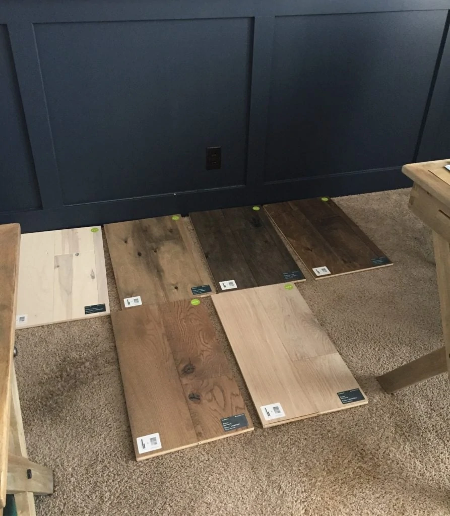 Testing the Mannington hardwood floor options against our board and batten navy wall.