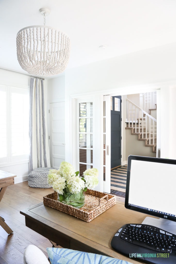 White bead chandelier with Benjamin Moore Simply White walls.