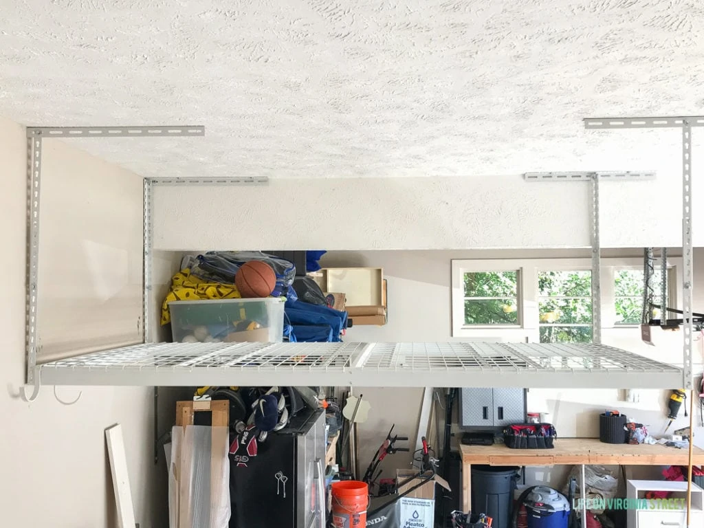 Garage door opened with items inside.