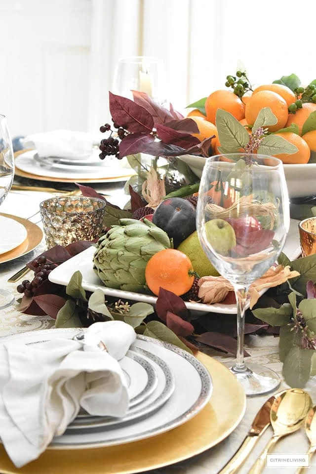 Citrine Living thanksgiving tablescape with citrus and tree fruits.