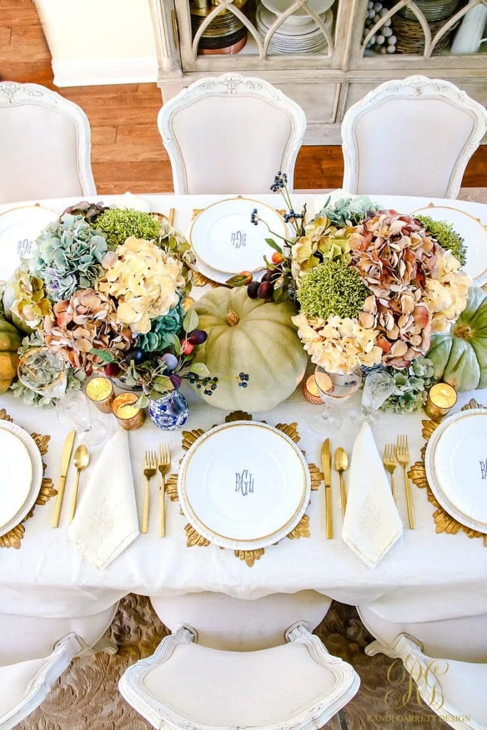 Randi Garrett Design Thanksgiving Tablescape with gold leaf, heirloom pumpkins and gorgeous florals.