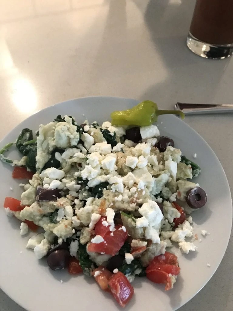 Our breakfast scramble with egg whites, olives, tomatoes, spinach and feta. Fancy brunch in the comfort of home!