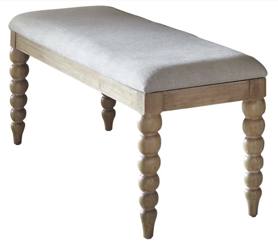 This upholstered spindle bench is definitely one piece of furniture I have my eye on and am considering purchasing for our home!