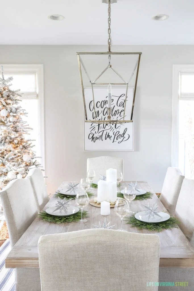 Great tips on how to transition your fall tablescape for the holidays. This glam winter wonderland table setting from @pier1 is full of metallics, neutrals and greens and works for both Christmas and New Year’s! I love the 'O Come Let Us Adore Him' canvas and beautiful table setting. #Pier1_partner #pier1love