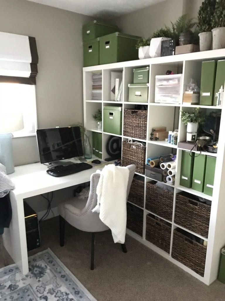 A large Ikea shelf in the office guest bedroom.