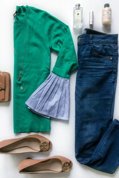 Green sweater with blue and white striped poplin sleeves, blue denim skinny jeans, came Tory Burch wedges, brown Tory Burch Wristlet, and the best perfume, lip condition and dry shampoo!