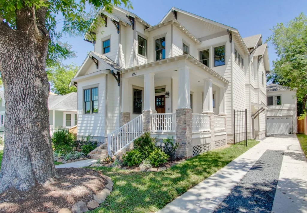 Exterior of home is painted Sherwin Williams Shoji White, a warm white tone.