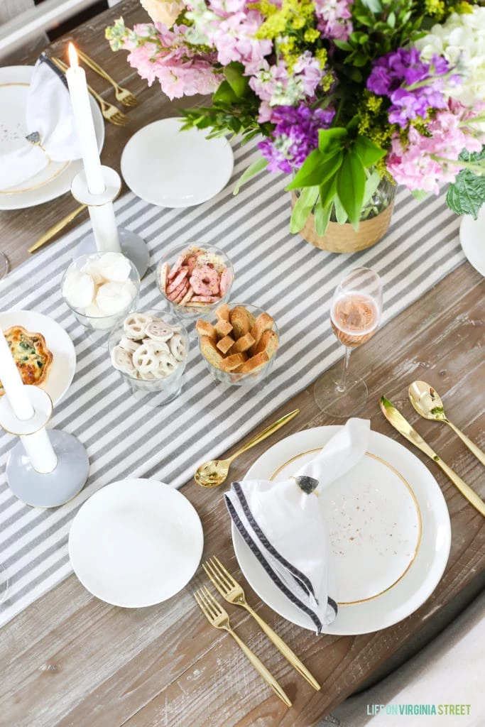 White chocolate pretzels, Cookes and a quiche on the table.