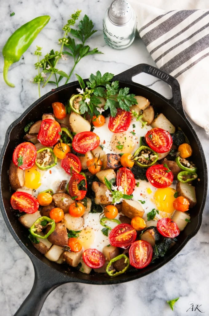 Potatoes, tomatoes and egg skillet cast iron.