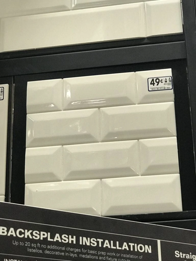 White subway backsplash in the packaging in the store.
