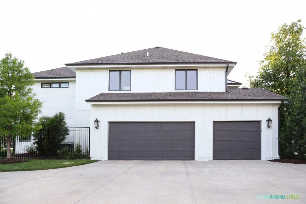 A white painted house with dark trim.