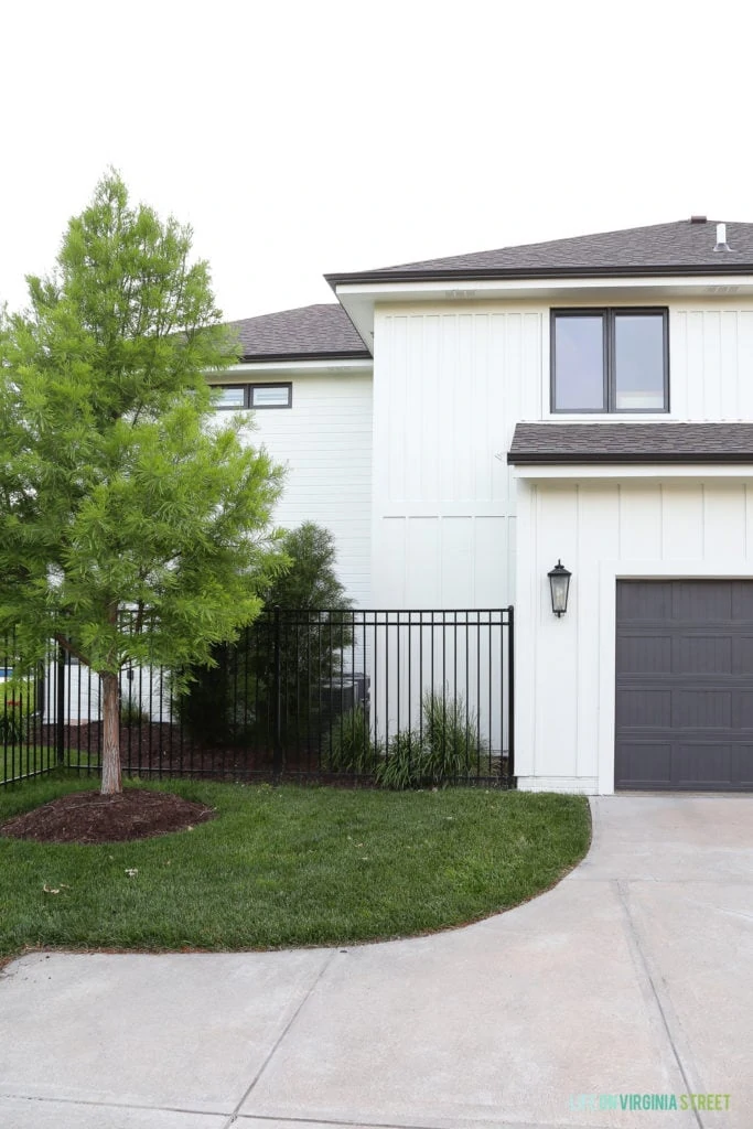 Benjamin Moore Iron Mountain garage doors with a White Dove painted house.