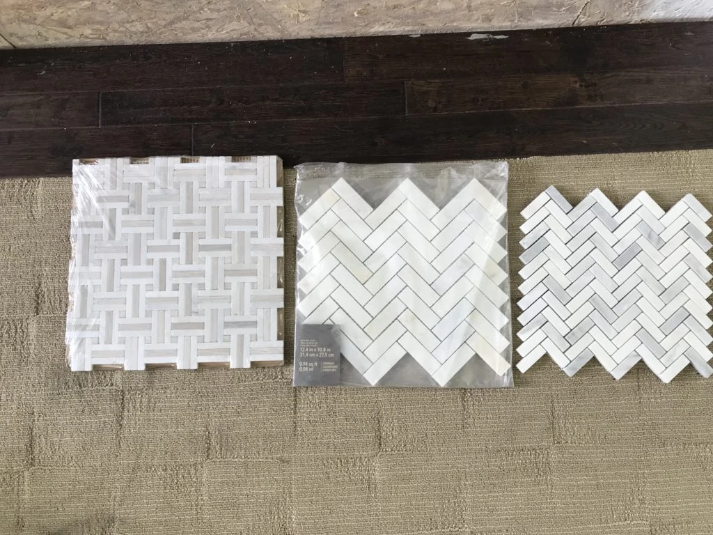 White tile samples on the floor.