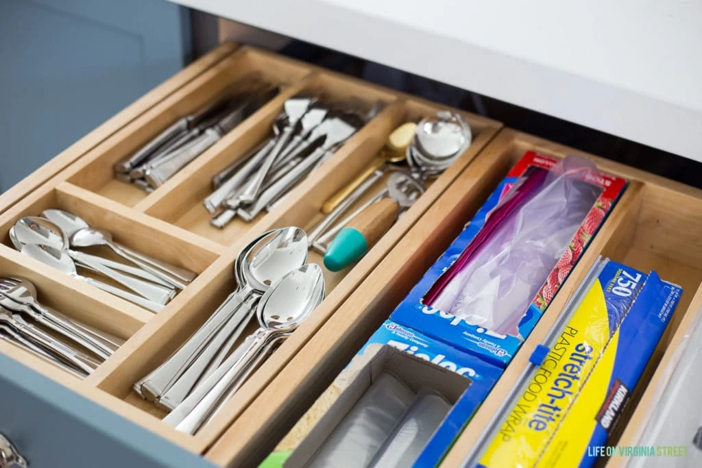 A drawer with a cutlery tray inside it.