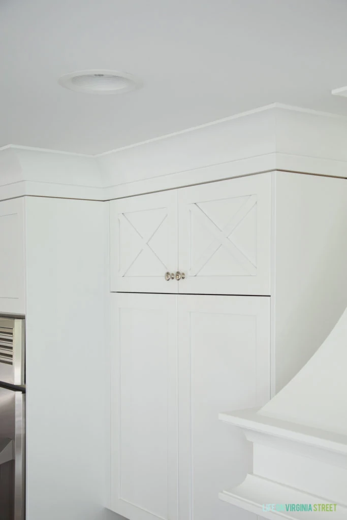 A small cupboard high up in the kitchen.