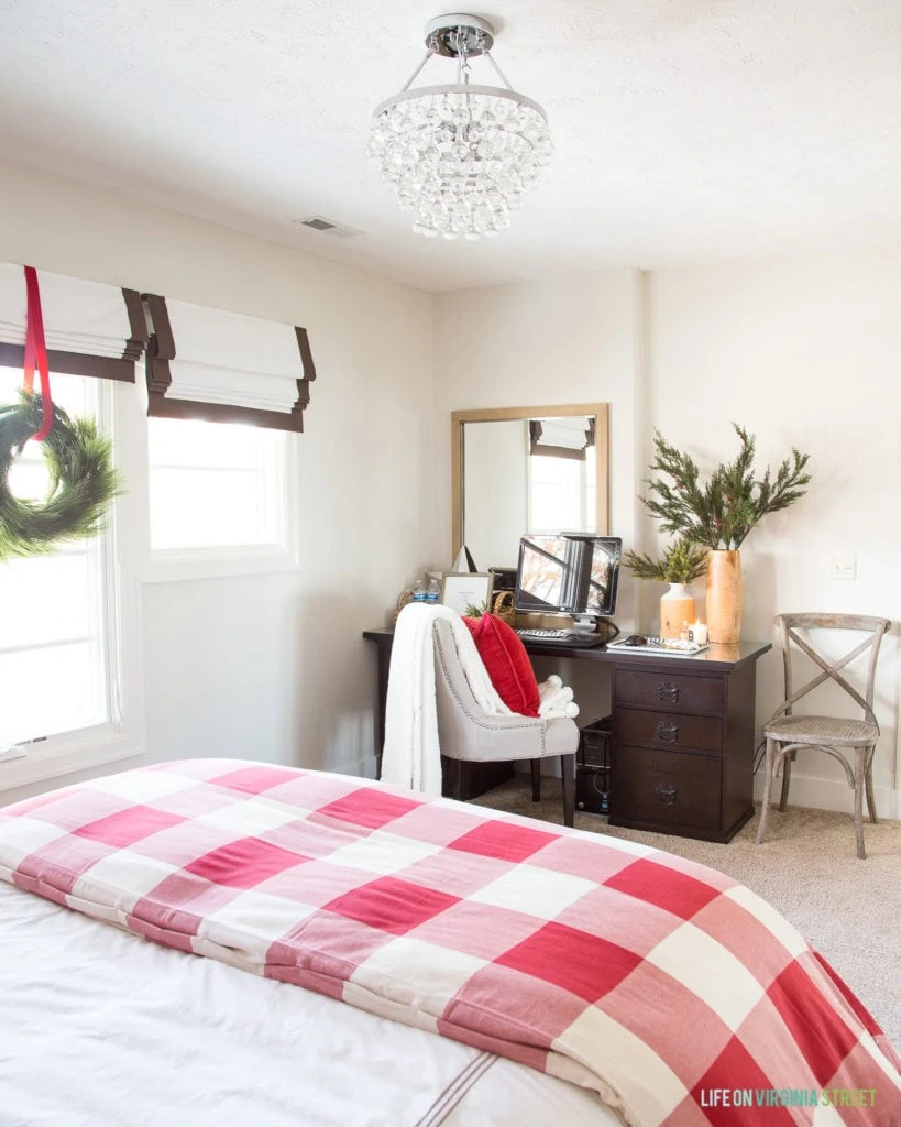 A desk area in a cute Christmas guest bedroom. I love the red and white buffalo check duvet cover.