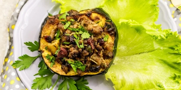 Air fryer roasted squash on a bed of lettuce leaves.